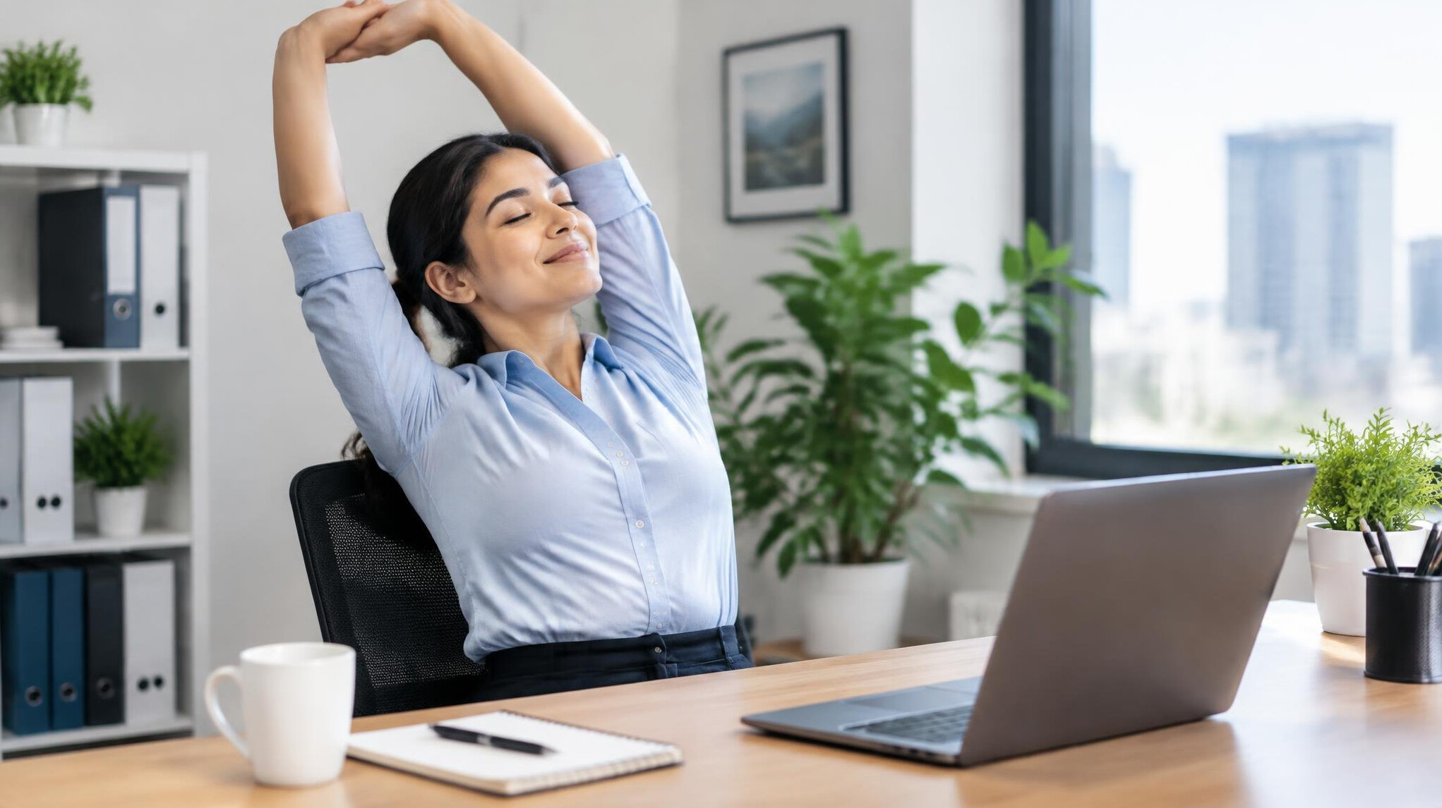 person stretching at office desk